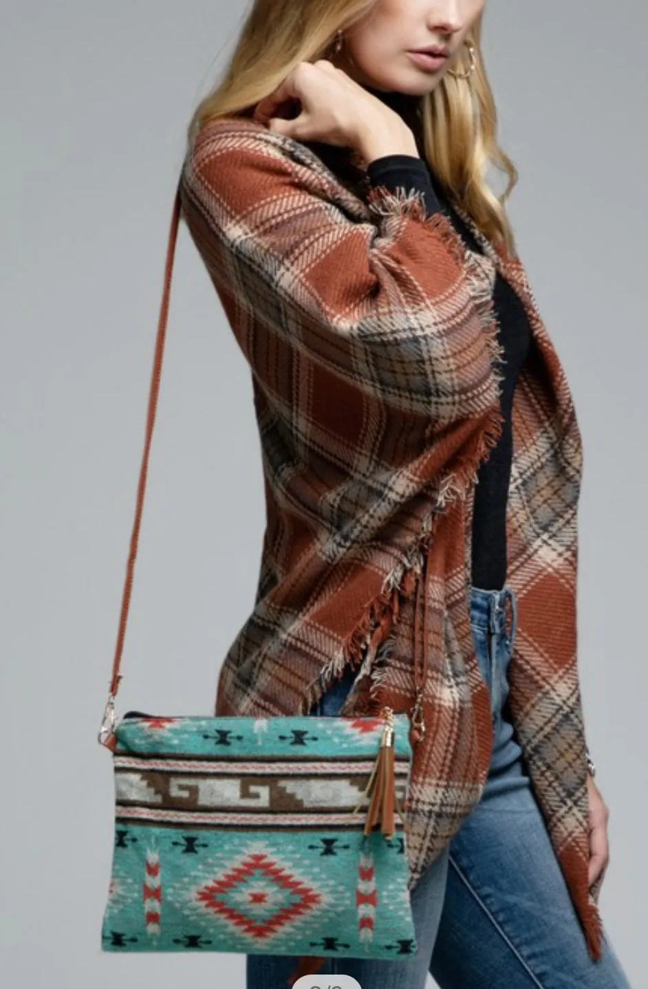 Turquoise western ethnic print with a detachable wristlet strap and tassel crossbody